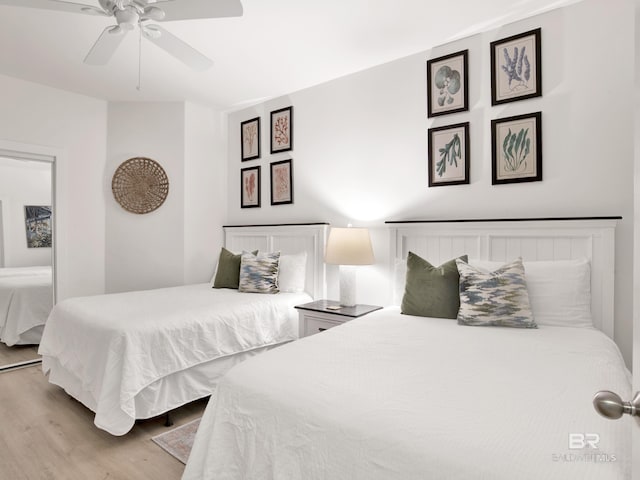 28105 Perdido Beach Blvd Unit C504, Orange Beach, AL 36561 - bedroom with a ceiling fan and wood finished floors
