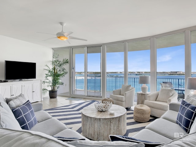 28105 Perdido Beach Blvd Unit C504, Orange Beach, AL 36561 - living room featuring a wall of windows, a water view, a ceiling fan, and tile patterned flooring