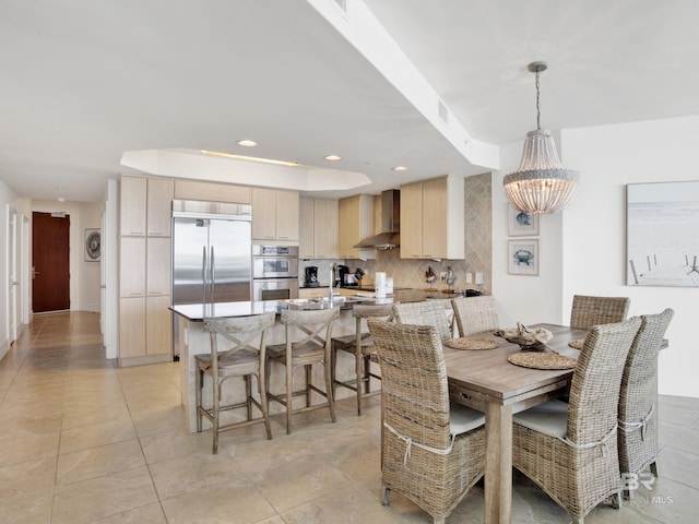28105 Perdido Beach Blvd Unit C504, Orange Beach, AL 36561 - dining space featuring light tile patterned floors, baseboards, recessed lighting, a chandelier, and a raised ceiling