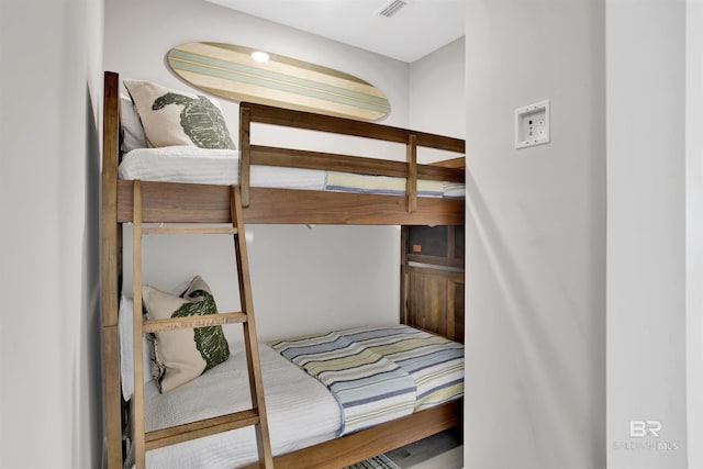 bedroom featuring visible vents