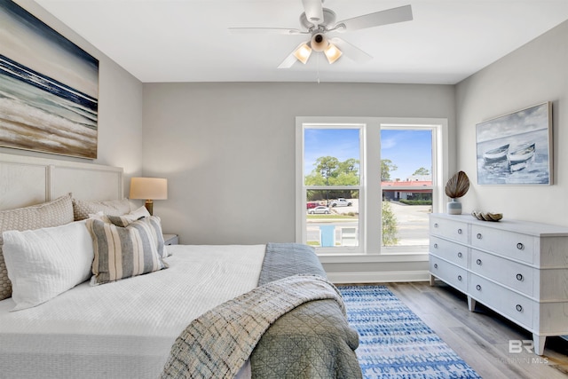 bedroom with a ceiling fan and wood finished floors