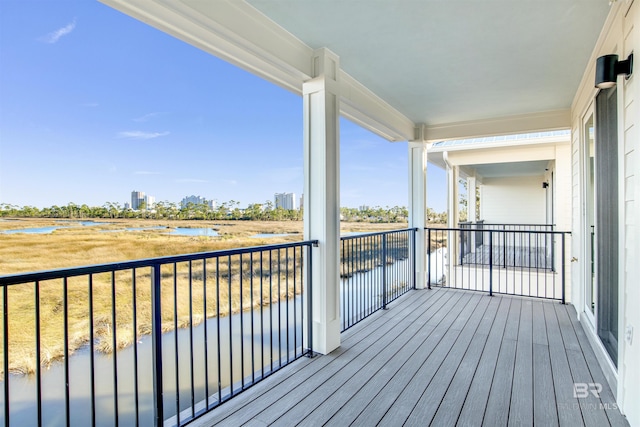 wooden terrace with a water view
