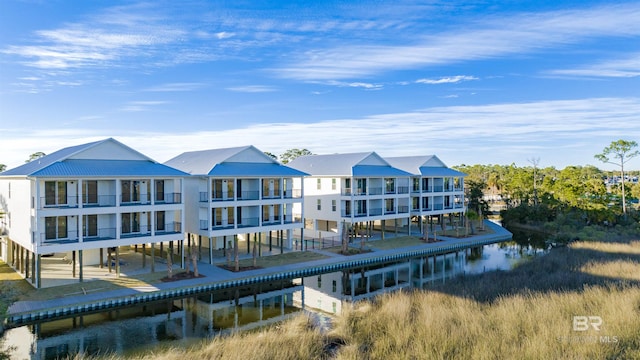 back of house with a water view