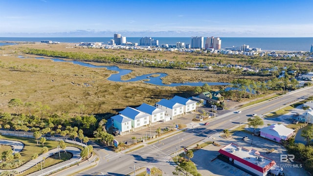 drone / aerial view with a water view and a city view