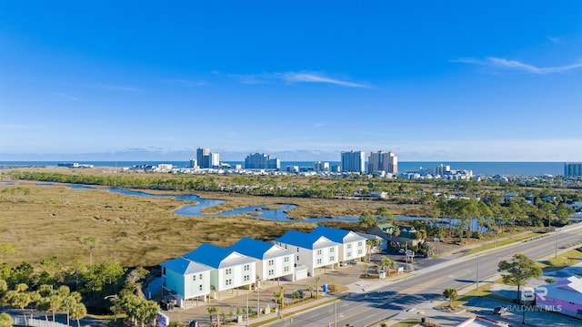 bird's eye view featuring a water view and a view of city