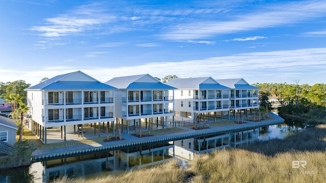 rear view of property featuring a water view