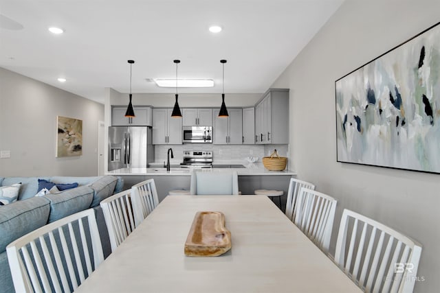 dining area featuring recessed lighting
