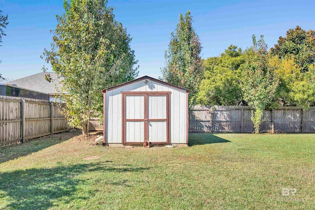 view of outbuilding with a lawn