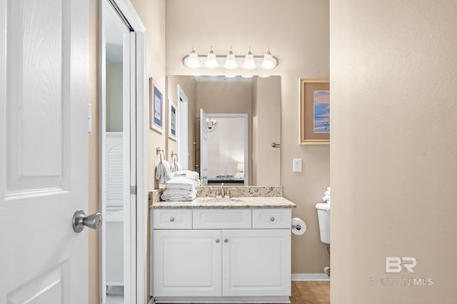 bathroom with vanity and toilet