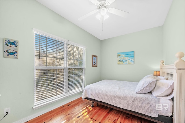 bedroom with hardwood / wood-style flooring and ceiling fan