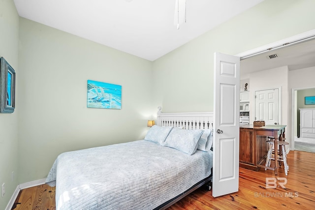 bedroom featuring wood-type flooring