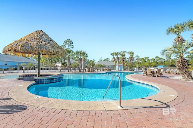 view of pool featuring a patio area and a community hot tub