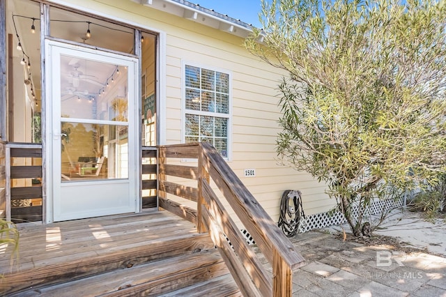 doorway to property featuring a wooden deck