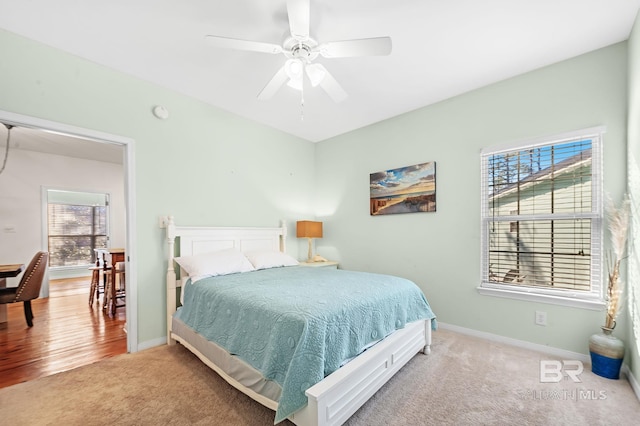 bedroom featuring ceiling fan and carpet