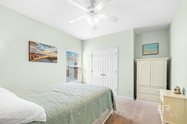 carpeted bedroom with a closet and ceiling fan