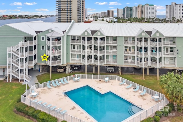 view of pool with a yard and a patio