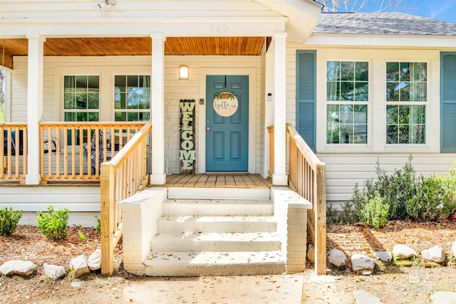 doorway to property with covered porch