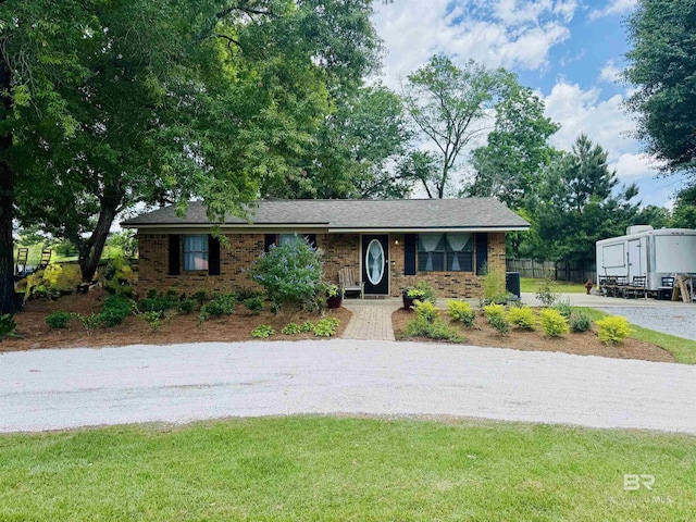 2274 Foshee Rd, Brewton, AL 36426 - view of front facade featuring gravel driveway and brick siding