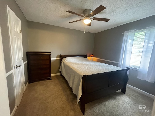 2274 Foshee Rd, Brewton, AL 36426 - carpeted bedroom featuring a textured ceiling and a ceiling fan