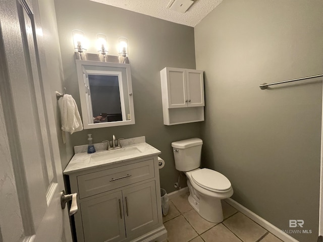 2274 Foshee Rd, Brewton, AL 36426 - bathroom with vanity, tile patterned floors, and a textured ceiling