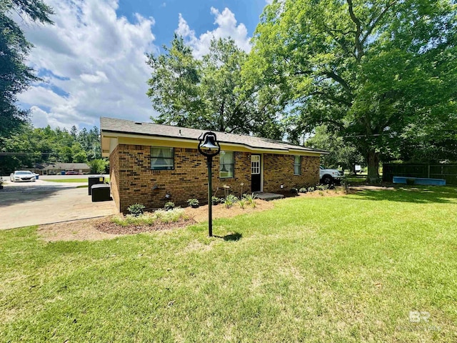 2274 Foshee Rd, Brewton, AL 36426 - back of property featuring a yard and brick siding