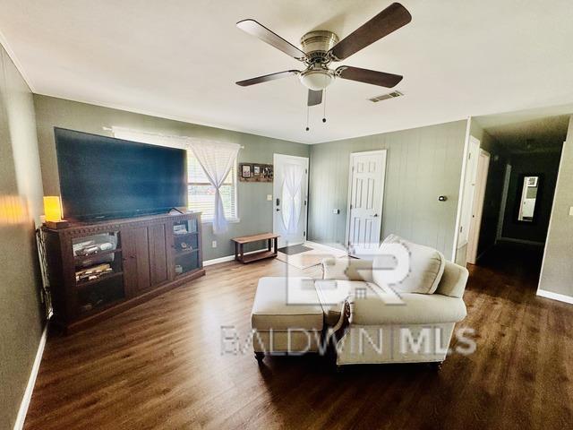 2274 Foshee Rd, Brewton, AL 36426 - living area with wood finished floors and ceiling fan