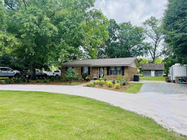 2274 Foshee Rd, Brewton, AL 36426 - ranch-style house featuring gravel driveway, a front yard, and brick siding