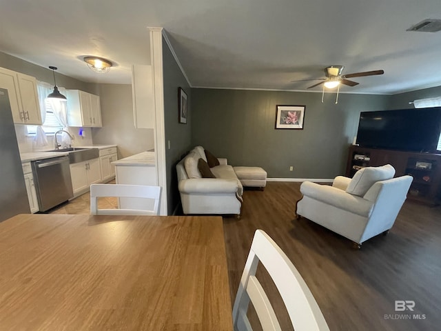 2274 Foshee Rd, Brewton, AL 36426 - living area featuring wood finished floors and ceiling fan