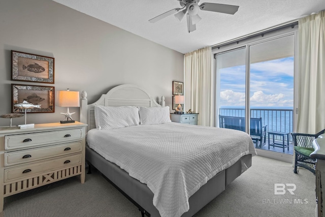 521 W Beach Blvd Unit 1702, Gulf Shores, AL 36542 - carpeted bedroom with access to exterior, multiple windows, expansive windows, and ceiling fan
