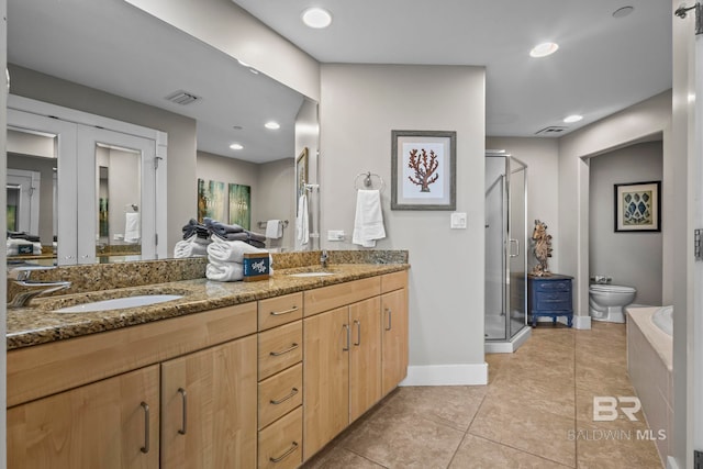 521 W Beach Blvd Unit 1702, Gulf Shores, AL 36542 - bathroom with double vanity, a shower stall, tile patterned floors, a bath, and french doors