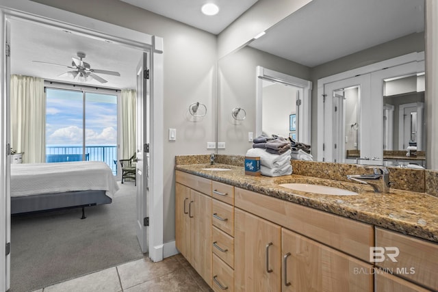 521 W Beach Blvd Unit 1702, Gulf Shores, AL 36542 - bathroom with ensuite bathroom, double vanity, ceiling fan, and tile patterned floors