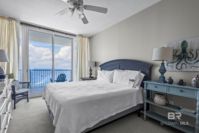 521 W Beach Blvd Unit 1702, Gulf Shores, AL 36542 - carpeted bedroom with expansive windows, access to exterior, a water view, and a ceiling fan
