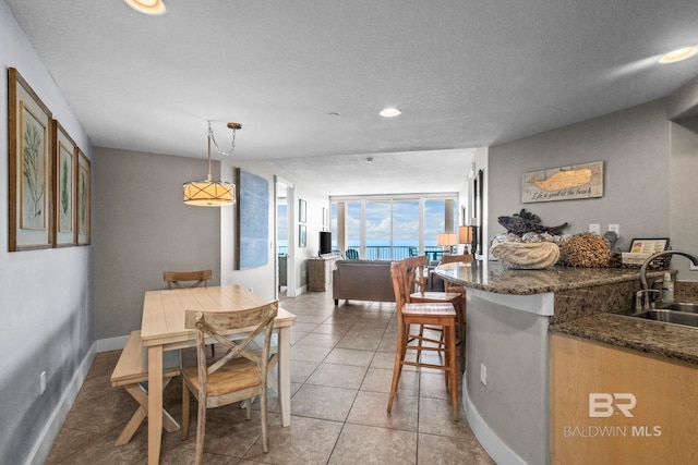 521 W Beach Blvd Unit 1702, Gulf Shores, AL 36542 - dining room with recessed lighting, a textured ceiling, and light tile patterned flooring