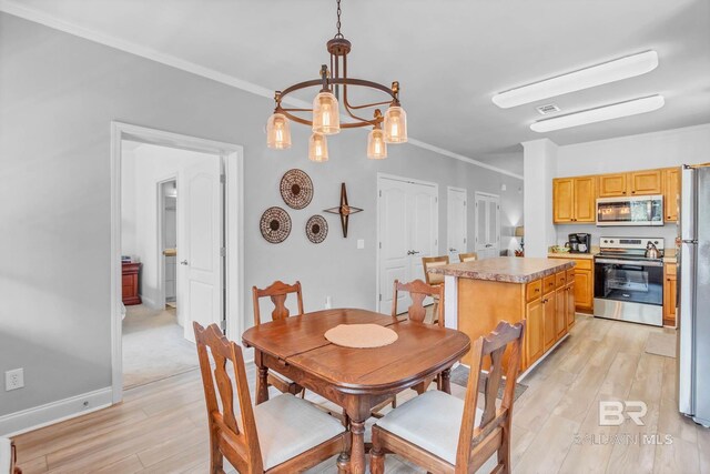 25806 Pollard Rd Unit 204, Daphne, AL 36526 - dining room with light wood-type flooring, crown molding, and a chandelier