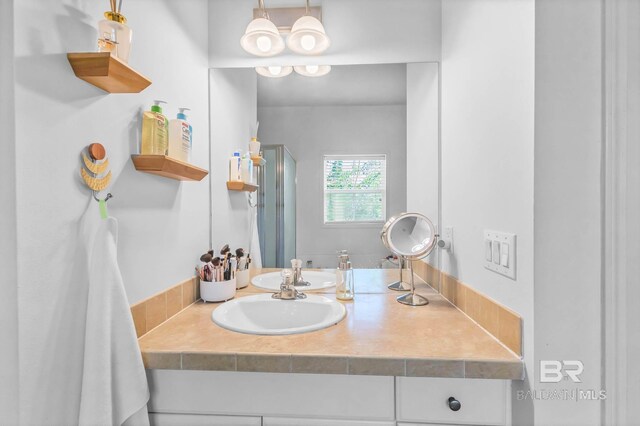 25806 Pollard Rd Unit 204, Daphne, AL 36526 - bathroom featuring vanity and a shower with shower door