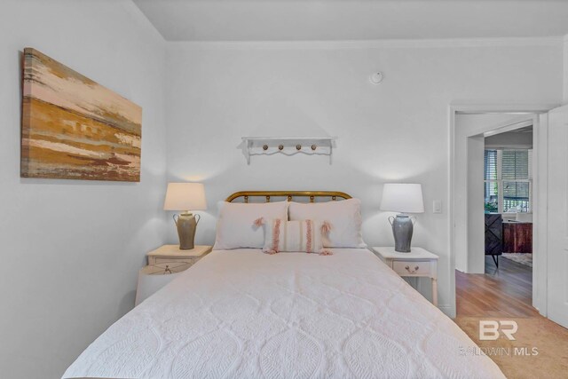 25806 Pollard Rd Unit 204, Daphne, AL 36526 - bedroom featuring crown molding and wood finished floors