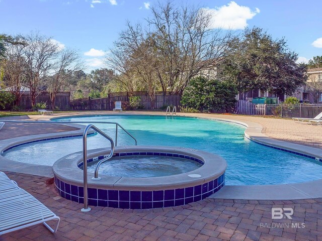 25806 Pollard Rd Unit 204, Daphne, AL 36526 - view of pool with a pool with connected hot tub and a patio