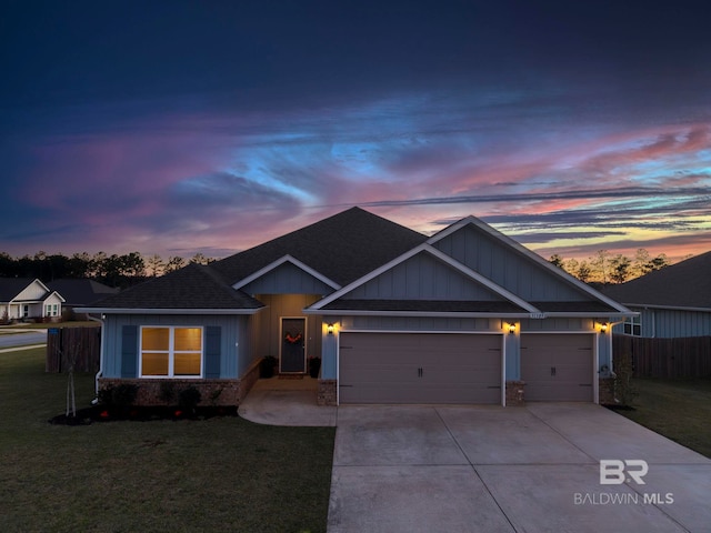 view of front of house with driveway, a yard, a shingled roof, a garage, and brick siding