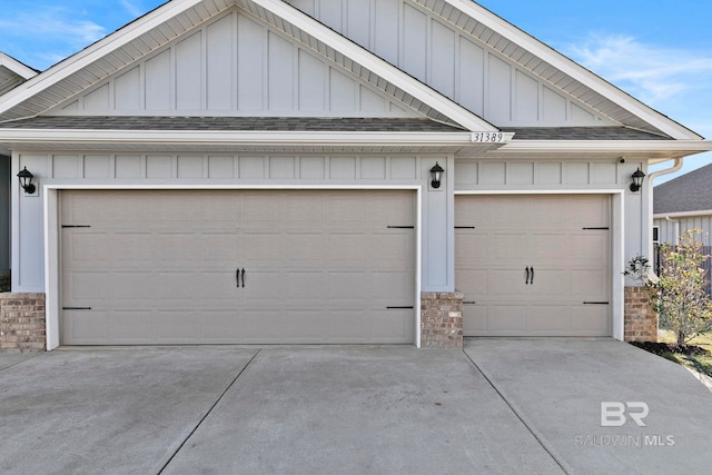 garage with concrete driveway