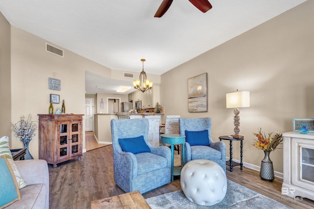 527 Beach Club Trl Unit C305, Gulf Shores, AL 36542 - living room featuring wood finished floors, visible vents, baseboards, and ceiling fan with notable chandelier