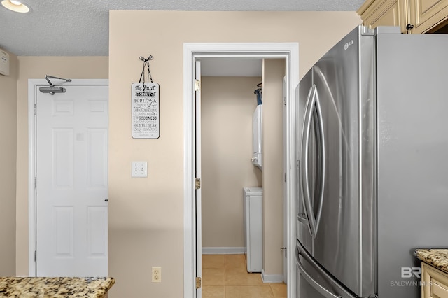 527 Beach Club Trl Unit C305, Gulf Shores, AL 36542 - clothes washing area featuring light tile patterned flooring, baseboards, and laundry area
