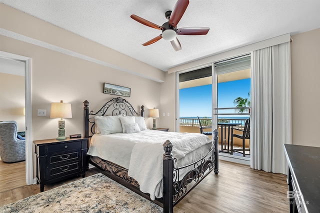 527 Beach Club Trl Unit C305, Gulf Shores, AL 36542 - bedroom featuring wood finished floors, access to exterior, and ceiling fan