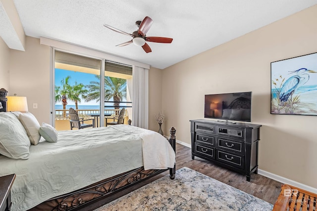 527 Beach Club Trl Unit C305, Gulf Shores, AL 36542 - bedroom featuring wood finished floors, baseboards, ceiling fan, and access to exterior
