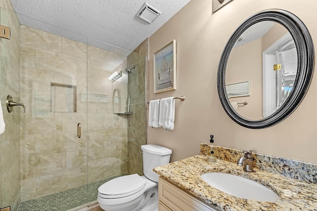 527 Beach Club Trl Unit C305, Gulf Shores, AL 36542 - bathroom featuring a shower stall, a textured ceiling, vanity, toilet, and visible vents