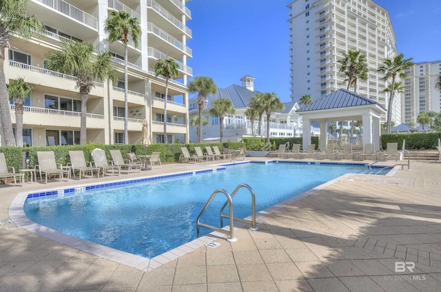527 Beach Club Trl Unit C305, Gulf Shores, AL 36542 - community pool featuring a gazebo and a patio area