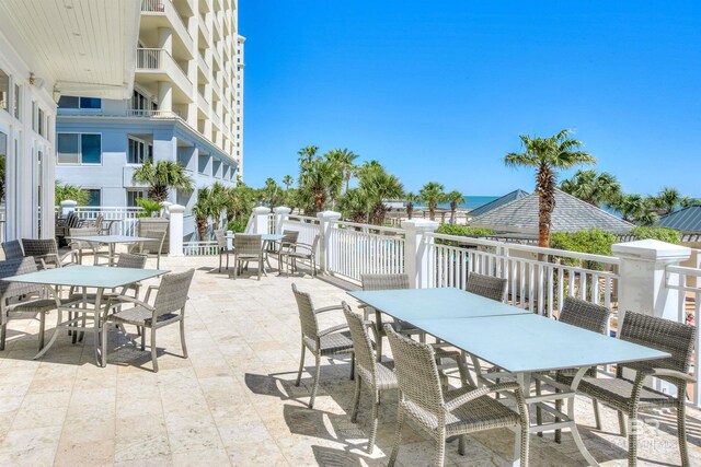 527 Beach Club Trl Unit C305, Gulf Shores, AL 36542 - view of patio / terrace featuring outdoor dining area and a water view