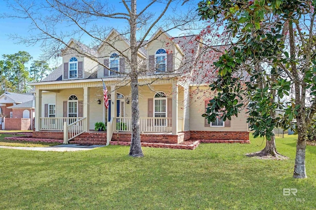 view of front of house featuring covered porch and a front lawn