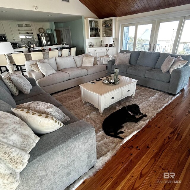 316 Quivira St, Dauphin Island, AL 36528 - living area featuring wooden ceiling, dark wood-style floors, and lofted ceiling