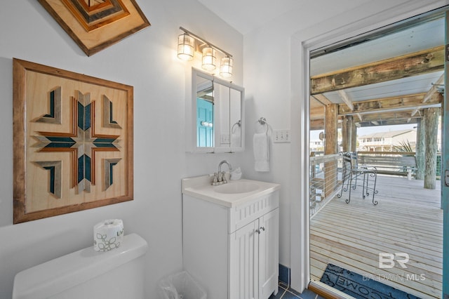 316 Quivira St, Dauphin Island, AL 36528 - half bath featuring vanity and toilet