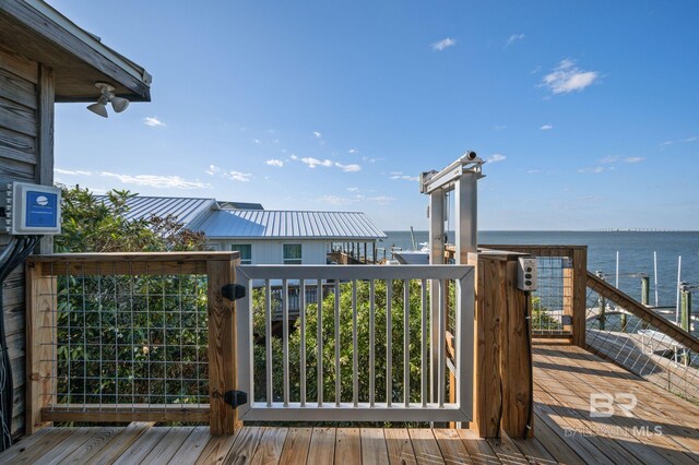 316 Quivira St, Dauphin Island, AL 36528 - wooden terrace with a water view